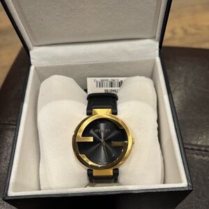 Gucci Black Dial Watch with Gold Interlocking G Bezel